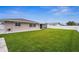 Side yard view of house showing exterior and backyard at 1236 Pinebrook Way, Venice, FL 34285