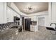 Modern kitchen features granite countertops, updated appliances, and stylish cabinetry at 1236 Pinebrook Way, Venice, FL 34285