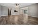 Open concept living area with hardwood floors and kitchen view at 1236 Pinebrook Way, Venice, FL 34285