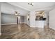 Open living room and kitchen area with wood-look floors at 1236 Pinebrook Way, Venice, FL 34285