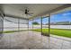 Spacious screened porch overlooking a grassy backyard at 1236 Pinebrook Way, Venice, FL 34285