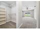 Large walk-in closet with shelving and hanging rods at 1236 Pinebrook Way, Venice, FL 34285