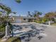Ranch-style home with attached garage and landscaped yard at 1300 Indus Rd, Venice, FL 34293