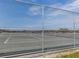 Tennis courts surrounded by chain link fence at 1300 Indus Rd, Venice, FL 34293