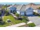 Two-story home with three car garage and paver driveway at 13072 Steinhatchee Loop, Venice, FL 34293