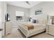 Guest bedroom with a queen-size bed and neutral colors at 13072 Steinhatchee Loop, Venice, FL 34293