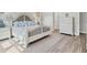 Spacious bedroom with a king-size bed, dresser and soft natural light at 13072 Steinhatchee Loop, Venice, FL 34293