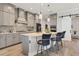 Gray shaker cabinets, quartz countertops, and stainless steel appliances in a modern kitchen at 13072 Steinhatchee Loop, Venice, FL 34293
