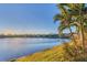 Scenic lake view with lush landscaping and homes at 13072 Steinhatchee Loop, Venice, FL 34293