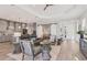 Open concept living area with kitchen and sliding doors at 13072 Steinhatchee Loop, Venice, FL 34293