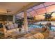 Covered patio with outdoor kitchen and lake view at 13072 Steinhatchee Loop, Venice, FL 34293