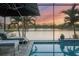 Enjoy sunset views from your screened lanai pool at 13072 Steinhatchee Loop, Venice, FL 34293