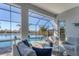Relaxing pool and patio area with lake views at 13072 Steinhatchee Loop, Venice, FL 34293