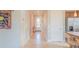 Bright and airy entryway with tile flooring and access to kitchen at 13164 Rinella St, Venice, FL 34293