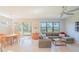 Spacious living room with large windows and comfortable sectional sofa at 13164 Rinella St, Venice, FL 34293