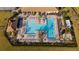 Large resort-style pool with plenty of lounge chairs at 13164 Rinella St, Venice, FL 34293
