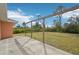 Large backyard with grassy area and wooden pergola at 13421 Gershwin Ln, Port Charlotte, FL 33981