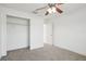 Spacious bedroom featuring a ceiling fan and a large closet at 13421 Gershwin Ln, Port Charlotte, FL 33981