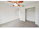 Spacious bedroom with ceiling fan and closet at 13421 Gershwin Ln, Port Charlotte, FL 33981