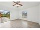 Light and airy bedroom featuring wood-look floors and sliding glass doors at 13421 Gershwin Ln, Port Charlotte, FL 33981