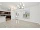 Bright dining room with tile floors and chandelier at 13421 Gershwin Ln, Port Charlotte, FL 33981