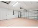 Garage with light colored floor and automatic garage door at 13421 Gershwin Ln, Port Charlotte, FL 33981