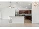 Open kitchen with dark cabinetry and granite counters at 13421 Gershwin Ln, Port Charlotte, FL 33981