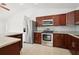 Modern kitchen with granite countertops and stainless steel appliances at 13421 Gershwin Ln, Port Charlotte, FL 33981