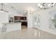 Open concept kitchen and dining area with granite countertops and stainless steel appliances at 13421 Gershwin Ln, Port Charlotte, FL 33981