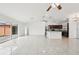 Bright and airy living room with tile flooring and access to backyard at 13421 Gershwin Ln, Port Charlotte, FL 33981