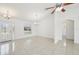 Bright living room with tile floors and sliding doors at 13421 Gershwin Ln, Port Charlotte, FL 33981