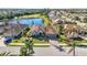 Aerial view of single Gathering home with lake and golf course views at 1348 Reserve Dr, Venice, FL 34285