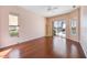 Bedroom with wood floors and pool access at 1348 Reserve Dr, Venice, FL 34285