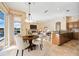 Open concept dining area with view of the kitchen and pool at 1348 Reserve Dr, Venice, FL 34285