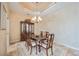 Formal dining room with wood furniture and a chandelier at 1348 Reserve Dr, Venice, FL 34285