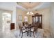 Formal dining room with wood furniture and a chandelier at 1348 Reserve Dr, Venice, FL 34285