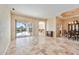 Elegant dining room with tile flooring and access to the pool area at 1348 Reserve Dr, Venice, FL 34285