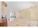 Bright and spacious entryway with tile flooring and a view of the living room at 1348 Reserve Dr, Venice, FL 34285