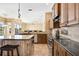 Bright kitchen features an island, breakfast bar, and stainless steel appliances at 1348 Reserve Dr, Venice, FL 34285