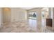 Spacious living area with tile flooring and sliding doors to the pool area at 1348 Reserve Dr, Venice, FL 34285