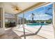 Enclosed patio overlooks a refreshing pool and spa at 1348 Reserve Dr, Venice, FL 34285