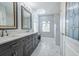 Elegant bathroom with double vanity and marble flooring at 1558 Belfry Dr, Venice, FL 34292