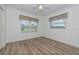 Bright bedroom featuring vinyl flooring and a view of the golf course at 1558 Belfry Dr, Venice, FL 34292