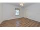 Well-lit bedroom with vinyl plank flooring and ceiling fan at 1558 Belfry Dr, Venice, FL 34292