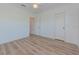 Simple bedroom with light walls and laminate floors at 1558 Belfry Dr, Venice, FL 34292