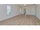 Spacious bedroom featuring light walls and laminate flooring at 1558 Belfry Dr, Venice, FL 34292