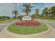 Waterford community entrance with landscaped grounds at 1558 Belfry Dr, Venice, FL 34292
