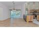 Bright dining room with access to the lanai at 1558 Belfry Dr, Venice, FL 34292