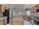 Spacious kitchen with granite countertops and stainless steel appliances at 1558 Belfry Dr, Venice, FL 34292