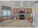 Kitchen boasts granite countertops and custom wood cabinets at 1558 Belfry Dr, Venice, FL 34292